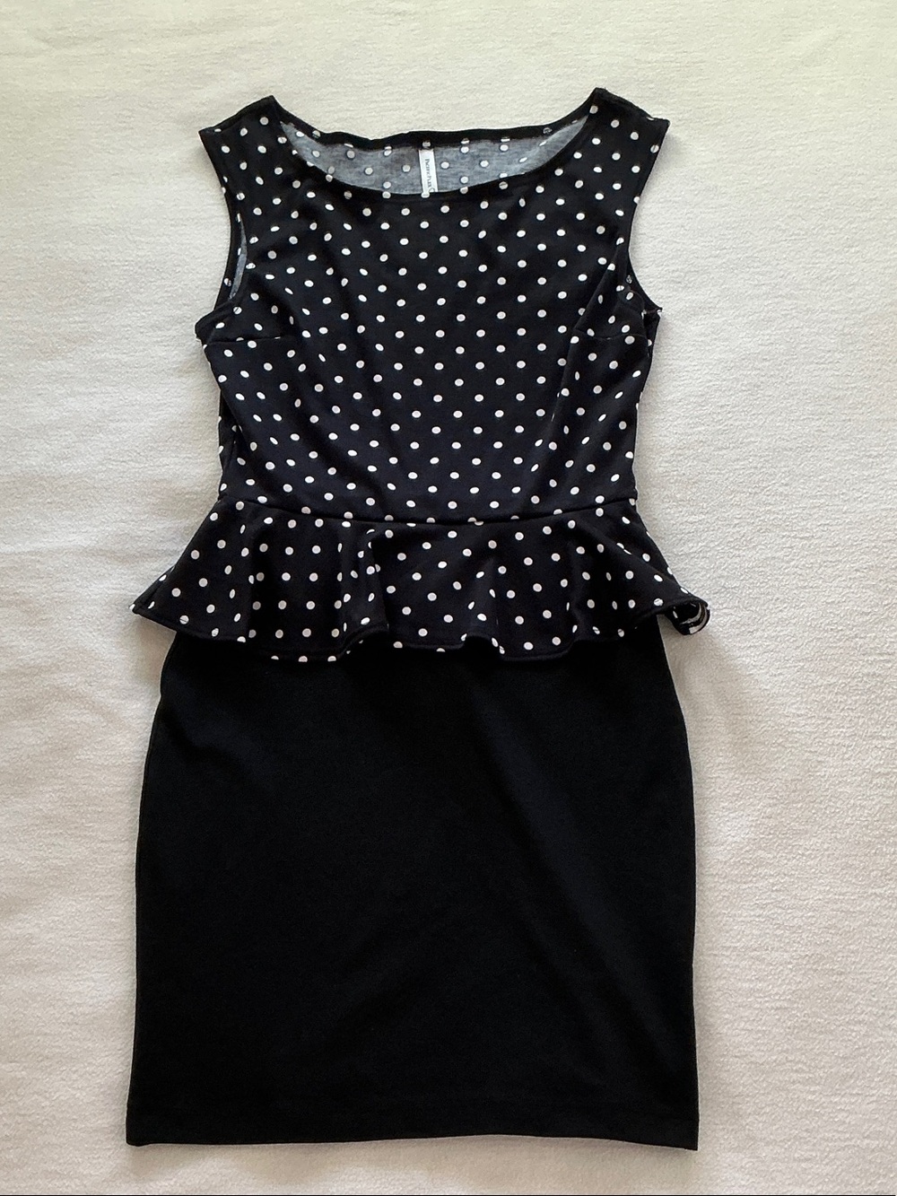 Sleeveless Black Peplum Mini Dress with White Polka Dots